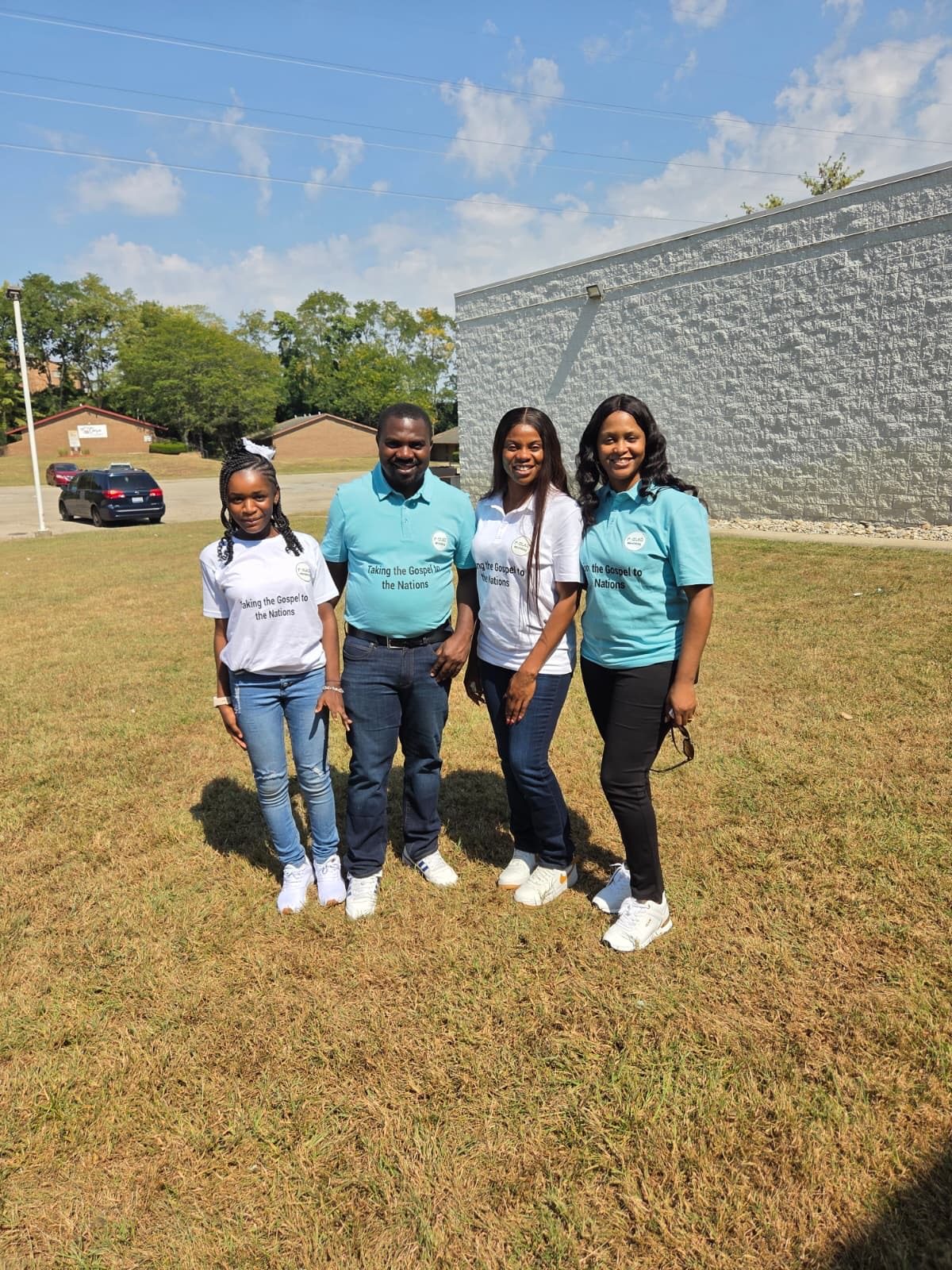 Four members of the street outreach team in teal shirts